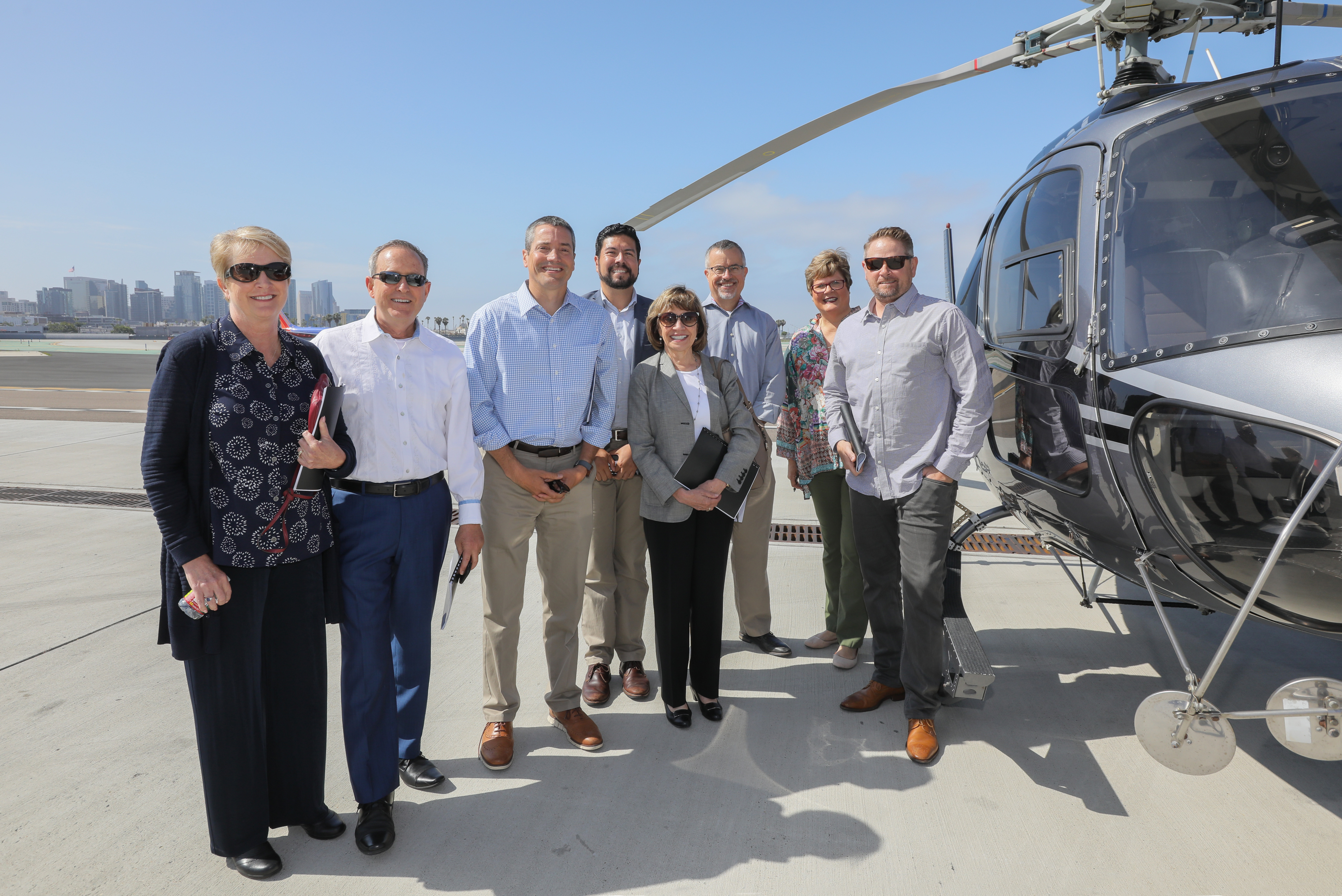 Construction workers gathering to commemorate the desalination of water via the Carlsbad plant.